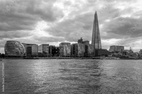 Southwark under dramatic clouds  black and white Thames in London.