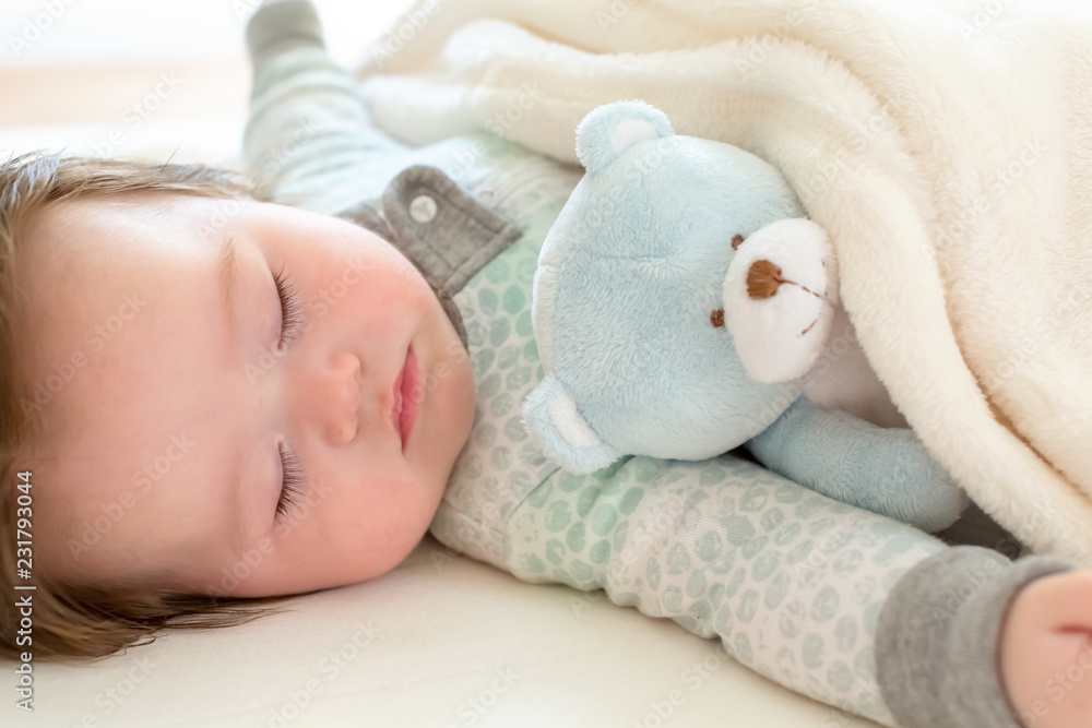 Sleepy little baby boy taking a nap Sleepy little baby boy taking a nap