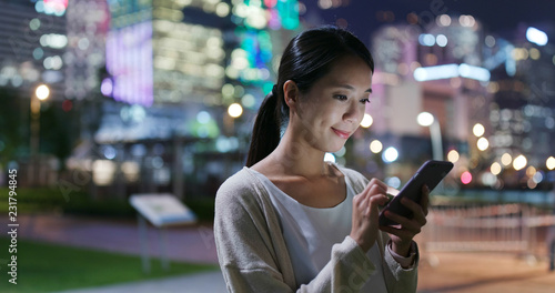 Photography Woman use of smart phone in city