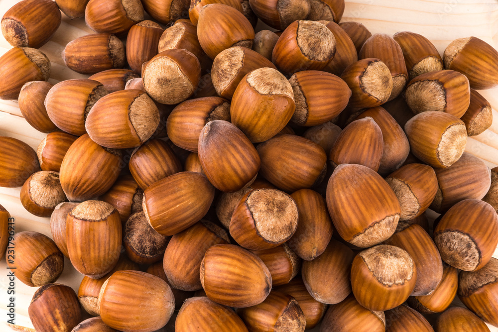 hazelnuts on wooden background hazelnuts on wooden background
