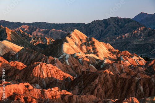 Zhangye Danxia National Geopark - Gansu Province, China. Chinese Danxia multicolor danxia landform, rainbow hills, rainbow mountains, sandstone erosion, layers of Red, Yellow and Orange stripes.