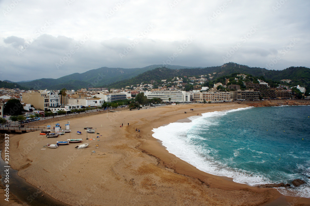 Spain.Costa Brava.The central beach of Tossa de Mar in bad weather.