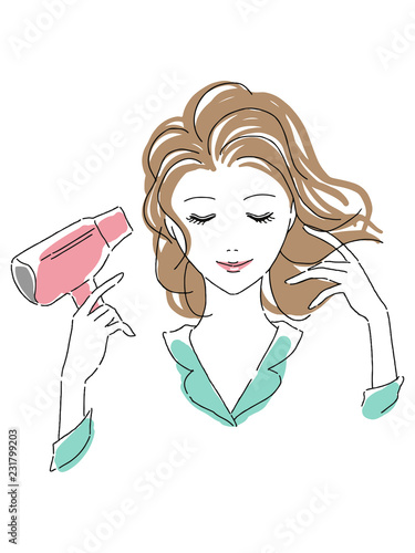 ドライヤーをかける女性