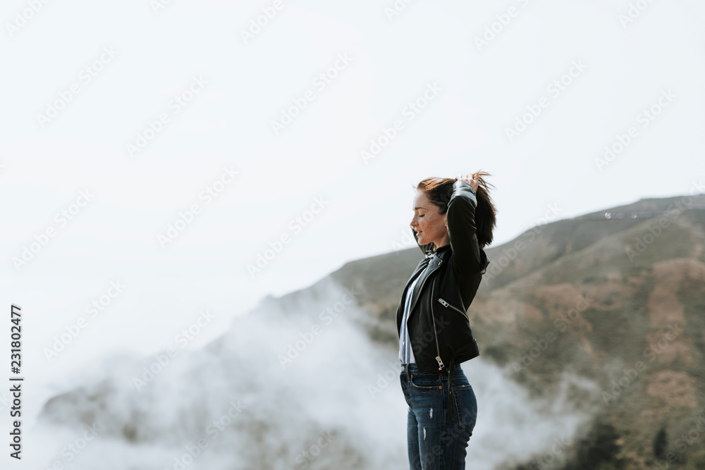 Woman enjoying a misty view