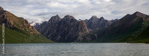 Nianbaoyuze - Holy Mountain in Jiuzhi County. Located in the Grassland of Guoluo Plain, Qinghai Province, China. High Altitude Goddess Lake, Mountains and flowers. Holy Tibetan Lake, Hiking Trekking photo