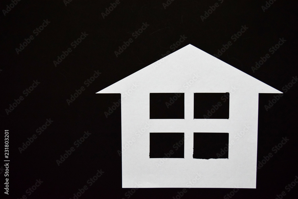Concept of house in paper on black background. Horizontal composition. Top view. Concept of house in paper on black background. Horizontal composition. Top view.