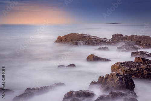 waves crashing on rocks