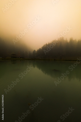 Misty morning fog at a lake in austria