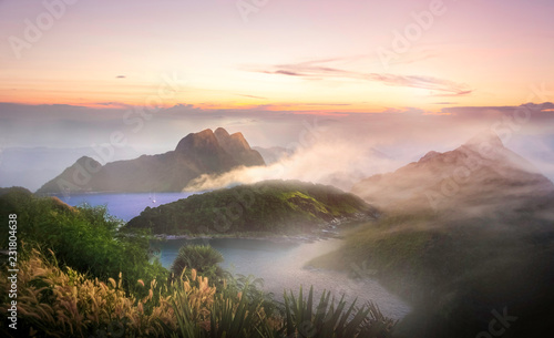 Out of focus of :Beautiful landscape with mist, sky and cloud from top mountain in Sunrise at Thailand