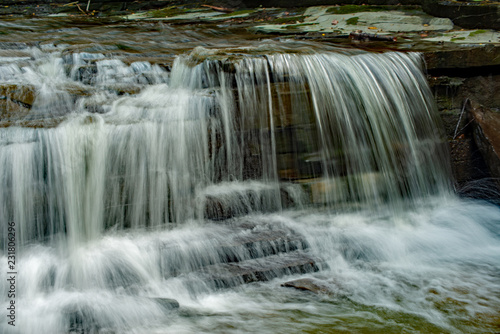 Waterfall cascading on the creek  finger lake