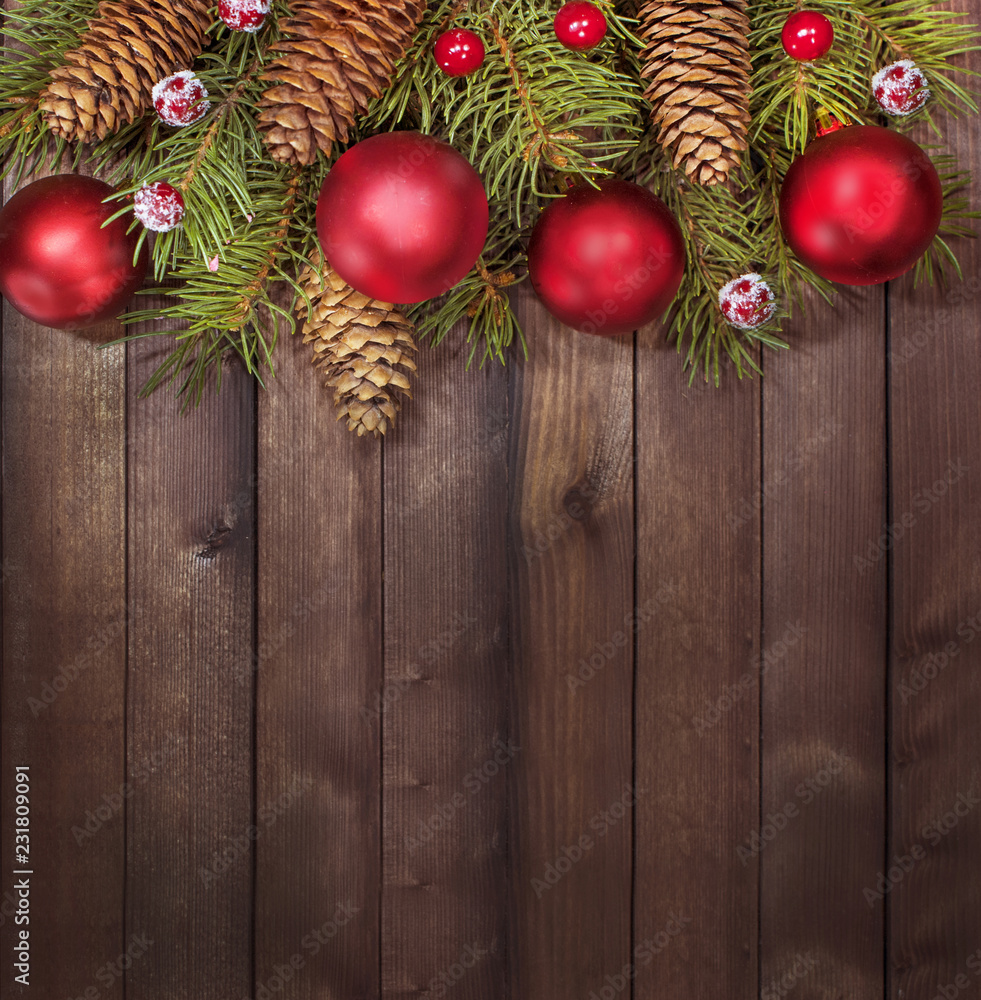 Christmas tree red ornaments on a wooden Board. Christmas and new year background. Free space for text. The view from the top. Christmas tree red ornaments on a wooden Board. Christmas and new year background. Free space for text. The view from the top.