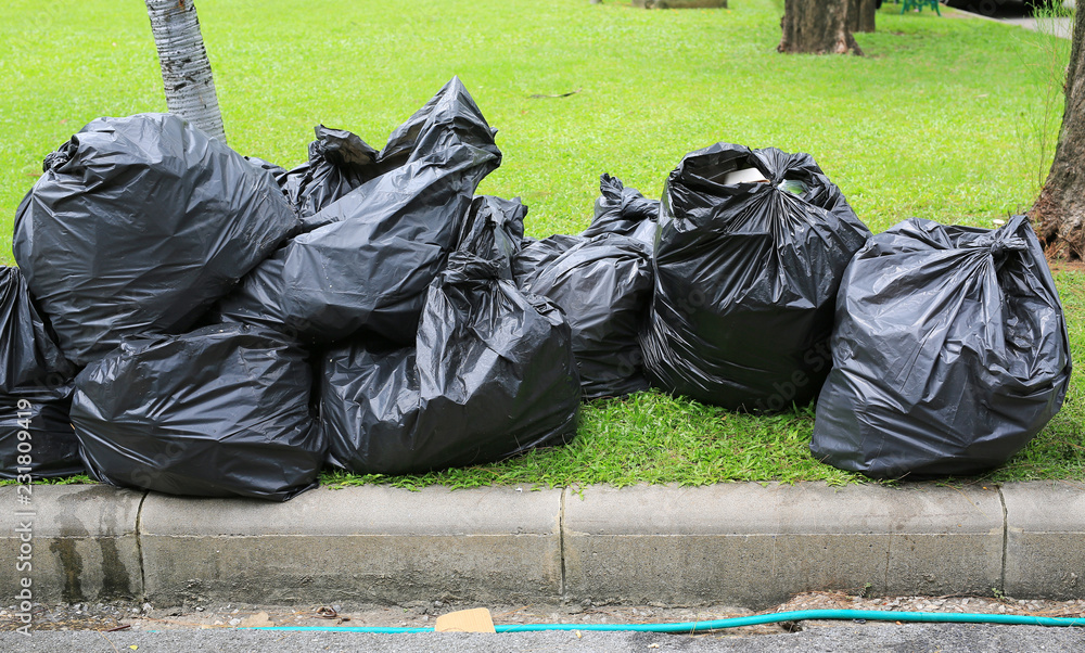 Black Plastic Trash Bags On Green Grass, How To Cover Garden With Black Plastic Bags