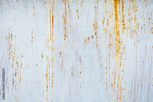 Rust on metal surfaces painted with white for design and advertising. There is space for copying of text input.