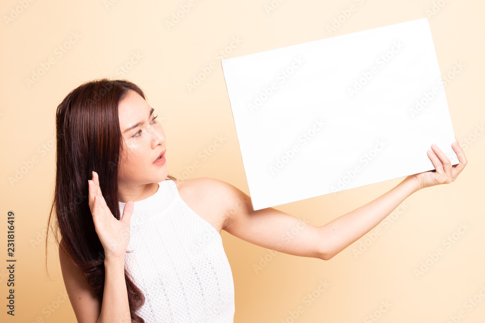 Young Asian woman surprise with white blank sign. Young Asian woman surprise with white blank sign.