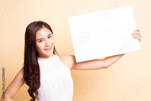 Young Asian woman with white blank sign.