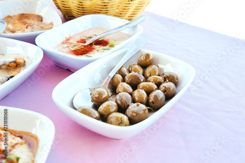 Traditional Cyprus Turkish and Greek dinner meze table appetizers olives hummus almond nuts
