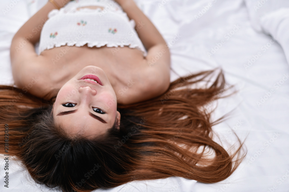 Naklejka premium Sexy women concept. Sexy girl are playing in the bedroom.