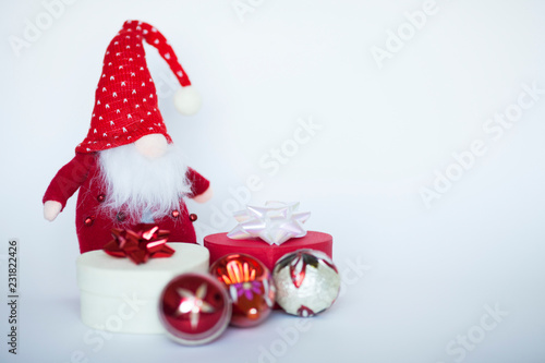 Wallpaper Mural Santa's assistant  with gifts on the white background. Christmas and New Year concept. Space for a text. Torontodigital.ca