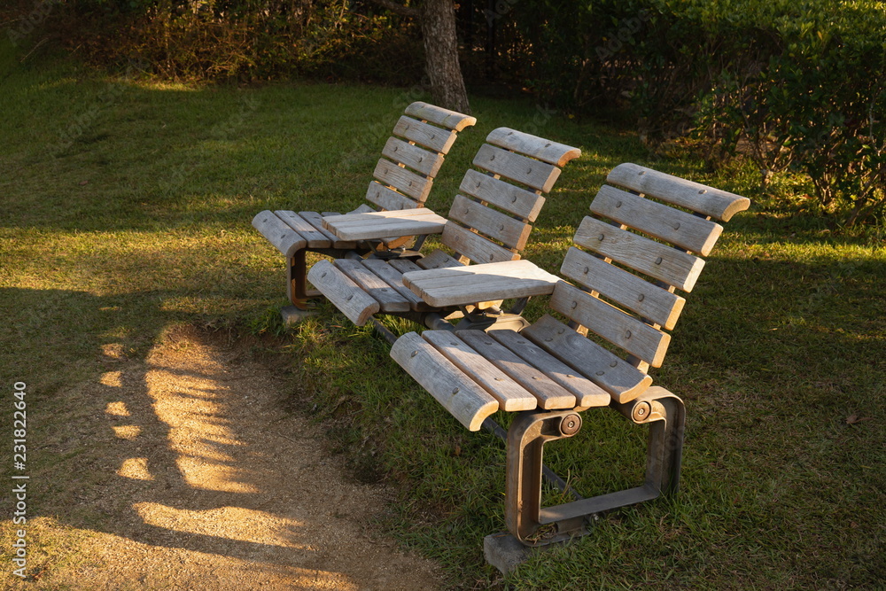 Wooden bench in the park at evening ,Shikoku,Japan Wooden bench in the park at evening ,Shikoku,Japan