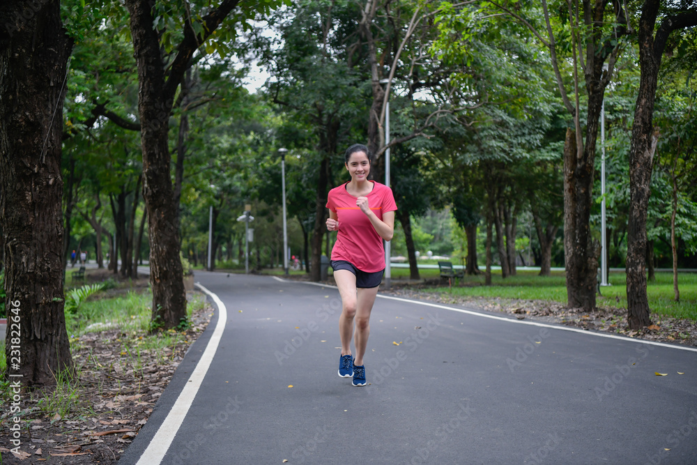 Exercise concept. Athletic girl exercising within the park. Beautiful girl jogging in the morning. Exercise concept. Athletic girl exercising within the park. Beautiful girl jogging in the morning.