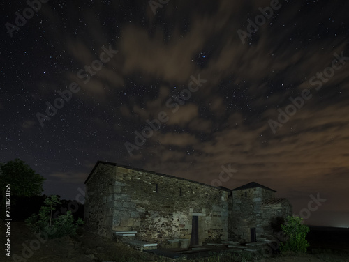 Night landscape with the Visigothic Basilica of Santa Lucia del Trampal. Acuescar. Spain. photo