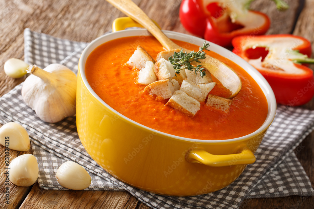 Homemade vegetarian bell pepper soup with croutons and herbs close-up. horizontal Homemade vegetarian bell pepper soup with croutons and herbs close-up. horizontal