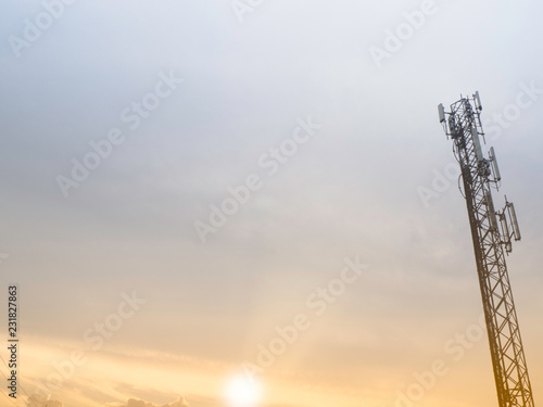 Mobile phone tower network antenna base station on the telecommunication mast radiating signal, Development of communication systems in urban area.