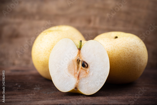Fresh Asian pear fruit on wooden background