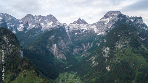 Aerial view of mountain range with snow in the alpine mountains