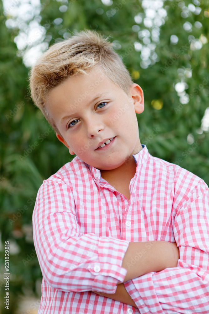 Happy child with pink shirt in the garden Happy child with pink shirt in the garden
