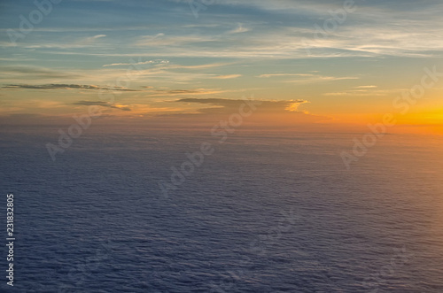 atmospheric mood above the clouds at sunset