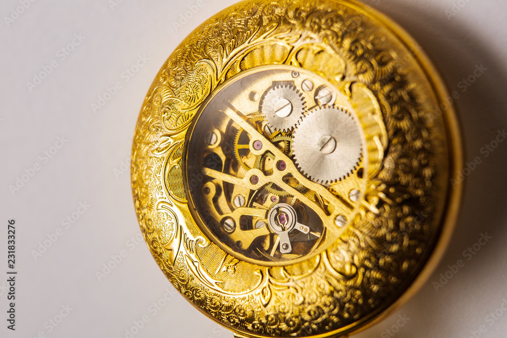 the inside of a classic watch gear wheels of a pocket watch the inside of a classic watch gear wheels of a pocket watch