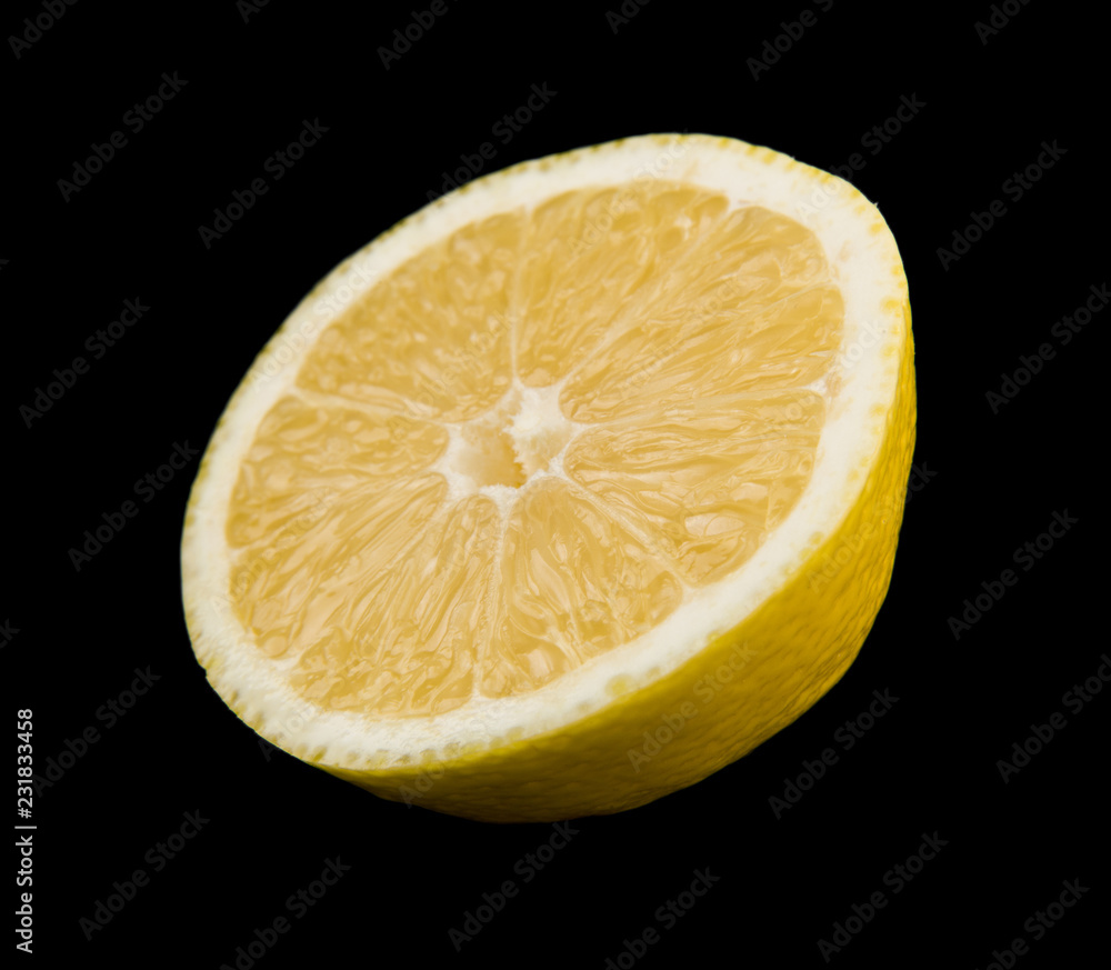 yellow juicy lemons isolated on a black background yellow juicy lemons isolated on a black background