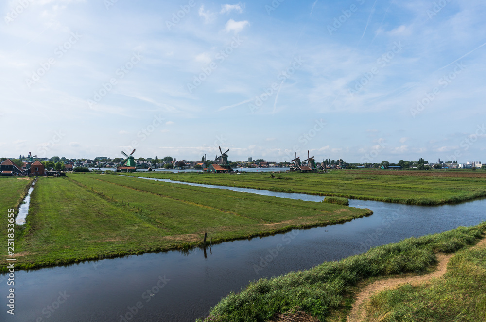 Wide panorama of Zaanse Schans Windmills. Peacefull countryside scene in Netherlands