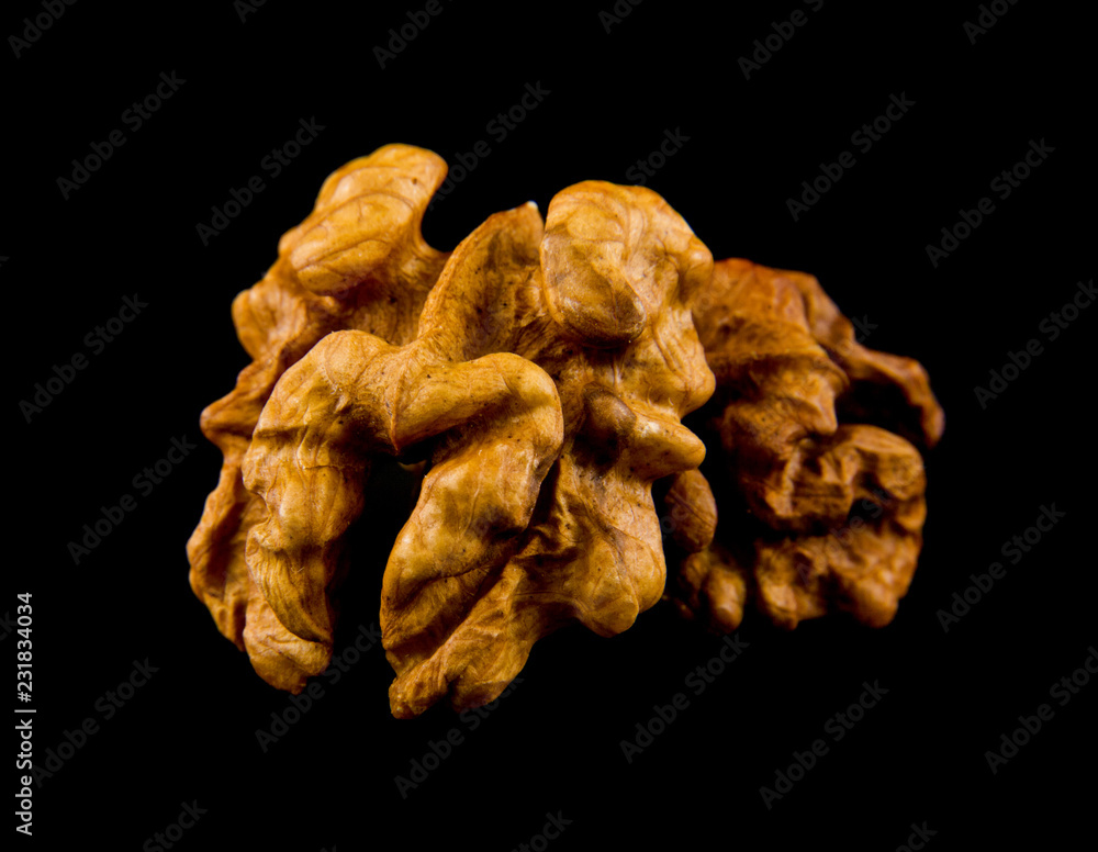 walnuts isolated on a black background walnuts isolated on a black background