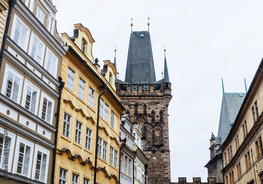 Lesser Town Bridge Towers. These two stylistically different towers, connected by a gate, form the entrance to the Lesser Town from Charles Bridge. Prague.  Czech Republic
