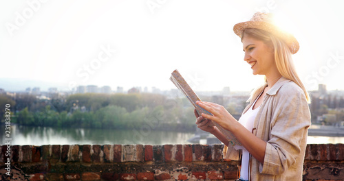 Tourist woman holding travelers map to travel to destination
