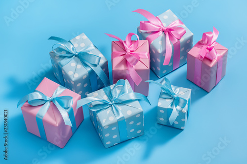 Collection of Christmas present boxes on light blue background