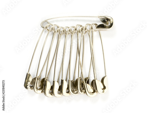 group of safety pins isolated on white background.