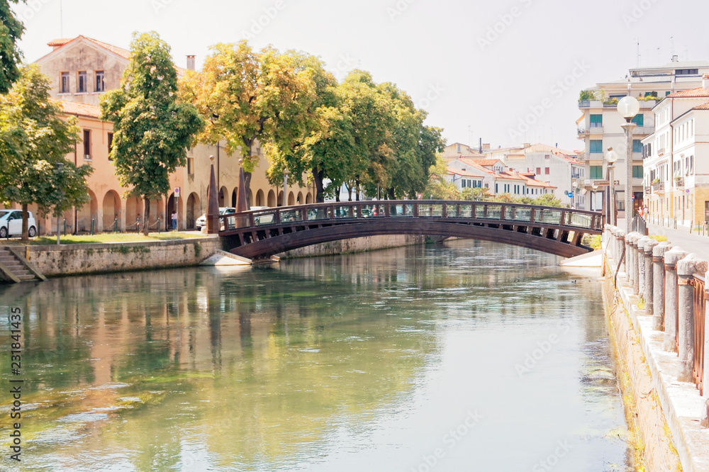 Treviso, Italy August 7, 2018: the river flows among the old buildings of the city. Treviso, Italy August 7, 2018: the river flows among the old buildings of the city.