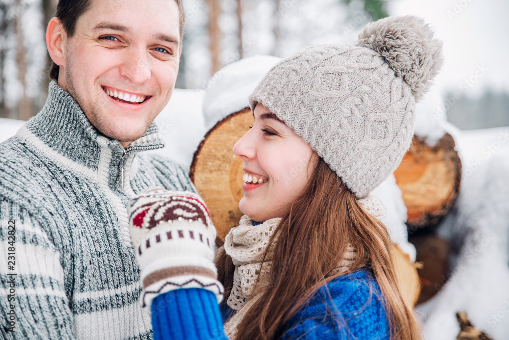 outdoor portrait of young sensual couple in cold winter wather. love and kiss outdoor portrait of young sensual couple in cold winter wather. love and kiss