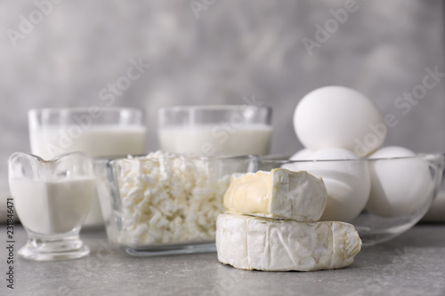 Different milk products on grey background