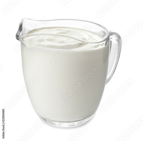 Принти на полотні Sour cream in jug on white background