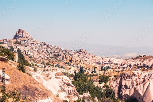 Ancient city in the rocks and hills, in Cappadocia, Turkey. Beautiful landscape in the desert, dry and hot. Famous touristic place. 