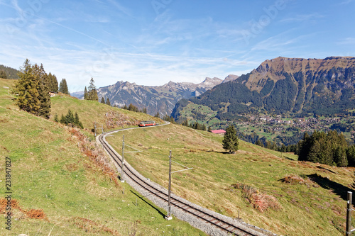 Panoramatic view of Jungfrau Region with incoming train from Gruetschalp (Grütschalp) near Winteregg, Jungfrau Region, Switzerland