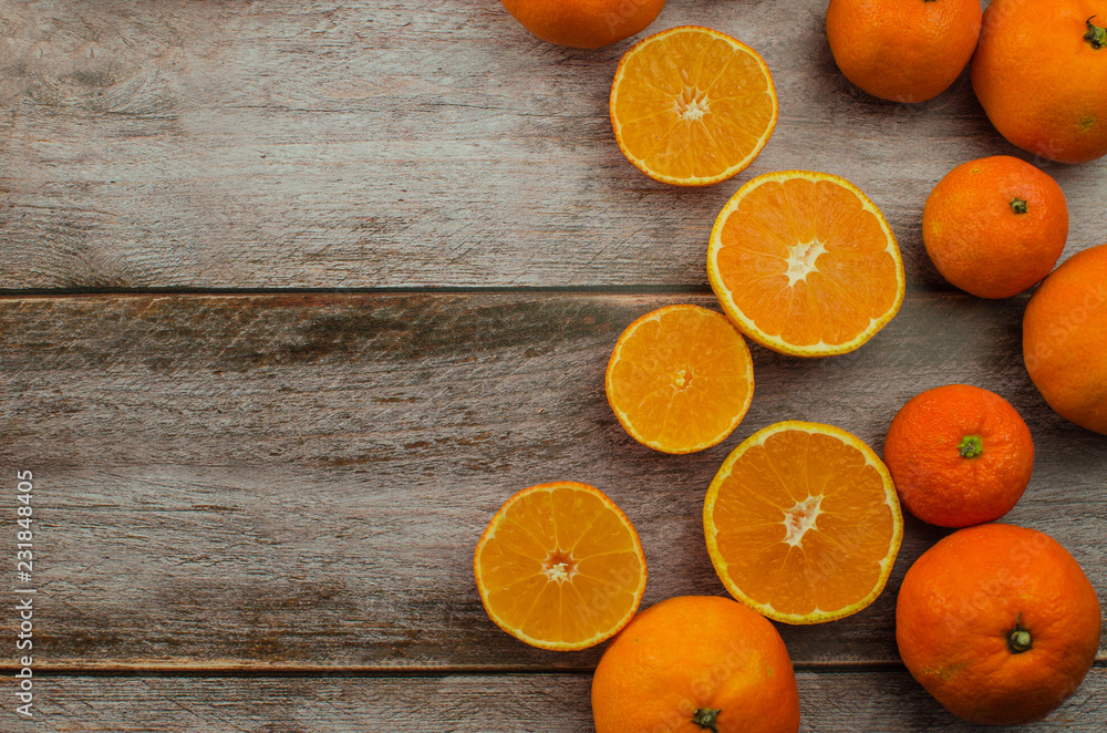 tangerines, peeled tangerine and tangerine slices on a white wooden table tangerines, peeled tangerine and tangerine slices on a white wooden table