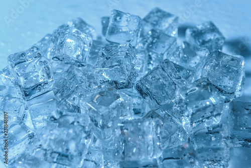 Ice cubes on color background