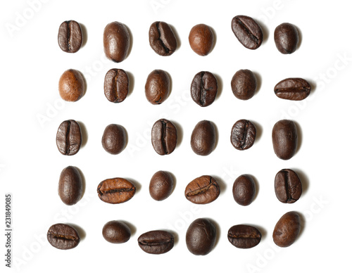 Roasted coffee beans on white background, flat lay