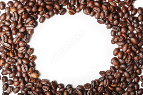 Frame made of roasted coffee beans on white background