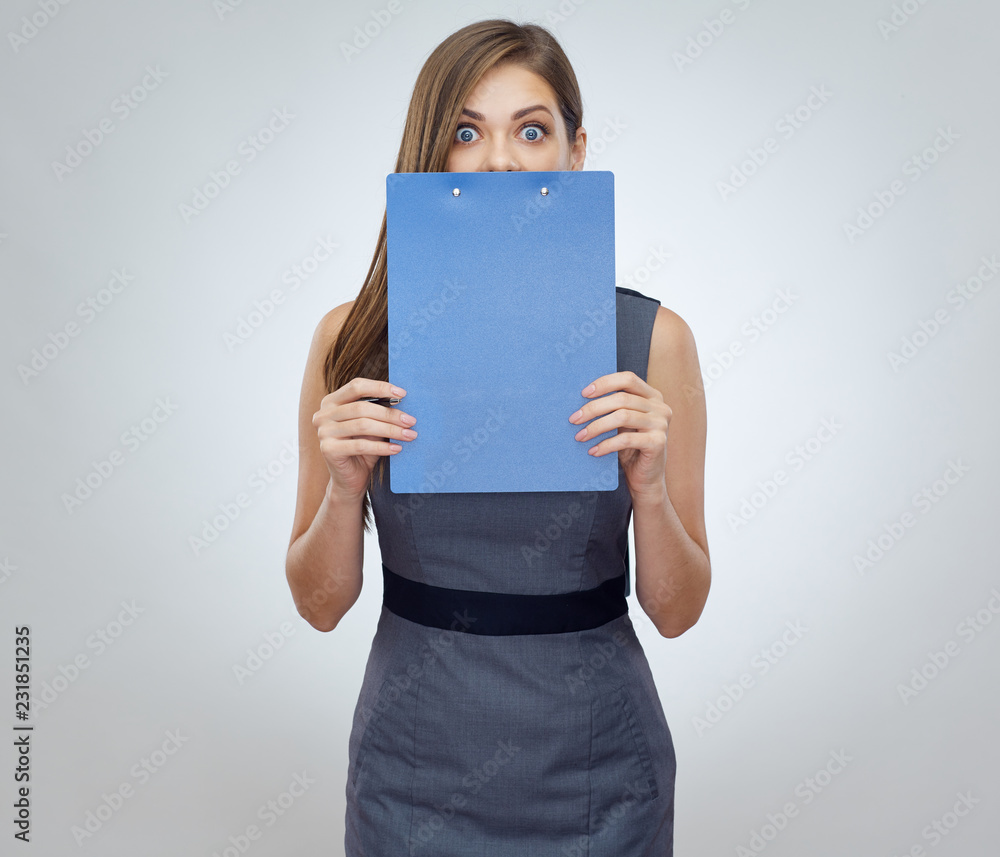 Surprising woman holding clipboard near face. Surprising woman holding clipboard near face.